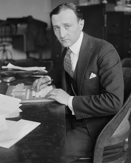Cryptologist William F. Friedman at work in 1924, intent in profile.