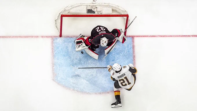 Overhead photo of Brandon Bussi making a pad save