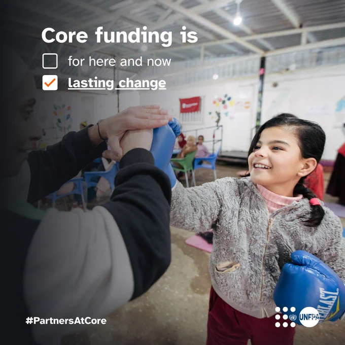 A photo of a girl wearing boxing gloves fist-bumping a woman. Text on the image reads: "Core funding is." There are two check boxes, one unchecked that reads "for here and now", one checked: "lasting change." The UNFPA logo is visible in the corner. The #PartnersAtCore logo is also displayed.