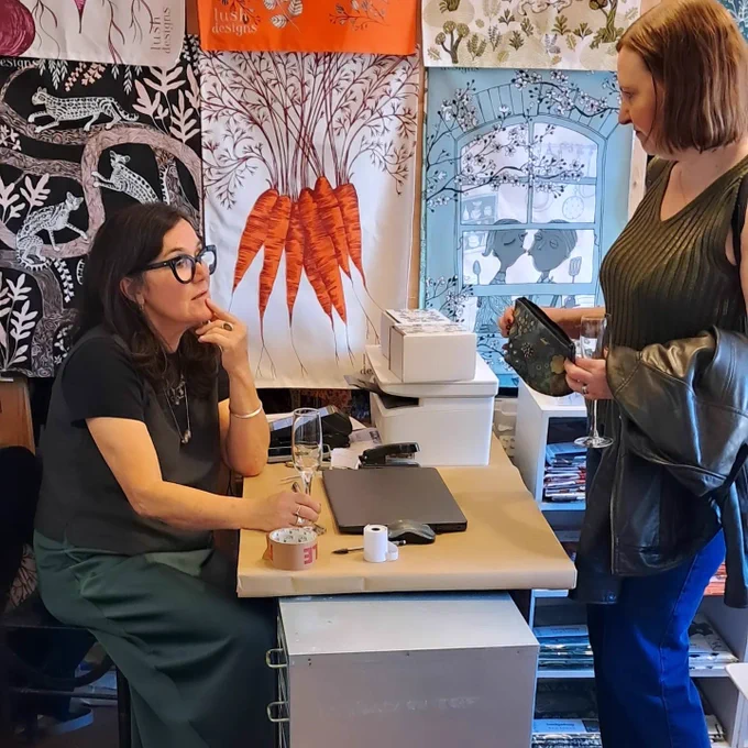 A photo of Vicky speaking with Marie Rodgers at Lush Designs.