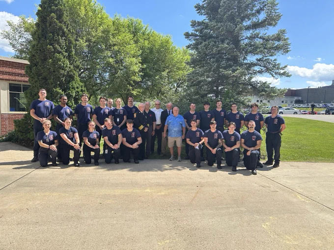 Group photo of the Recruit School classes of 2026 and 1976 together.