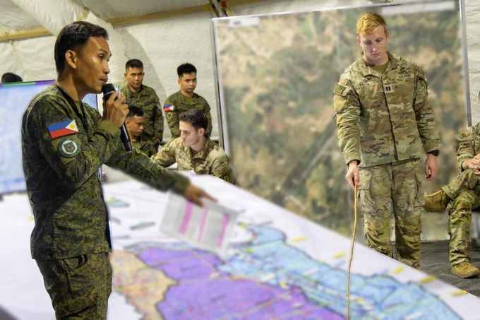 U.S. and Philippine Army Soldiers conduct a mission brief prior to Operational Maneuver, the culminating mission of Exercise Salaknib 2026, at Fort Magsaysay, Nueva Ecija, Philippines, June 1, 2026. The briefing synchronized participating units, outlined mission objectives, and coordinated movement plans, demonstrating the capabilities of the partner nations to coordinate plans and command and control. Exercise Salaknib highlights the enduring U.S.-Philippine alliance, enhancing interoperability and readiness through combined-arms operations, multi-domain integration, and humanitarian assistance efforts to support regional stability. Parts of image blurred for security (U.S. Army photo by Pfc. Jose Nunez)