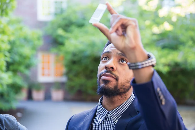 Timothy Vernon (MEng’17 BioE) holds up a device designed to fabricate a high throughput microfluidic platform for single cell RNA sequencing. Such a tool has the potential to provide libraries of quantitative data for computational analysis and ultimately help researchers better understand the complex, heterogeneous mass of cells that is the human body. 