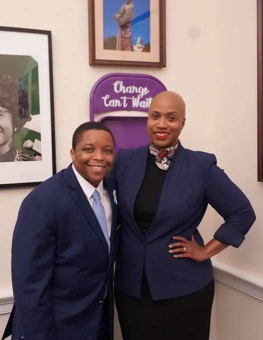 Rep. Ayanna Pressley and Eric James pose for a photo.