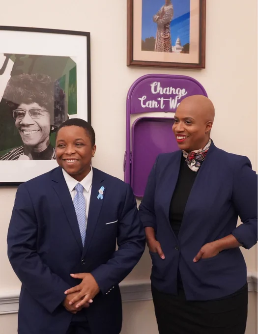 A photo of Rep. Ayanna Pressley and Eric James laughing.
