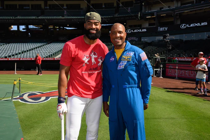 Jo Adell and NASA Astronaut Pilot Victor Glover smile for a photo together during Angels batting practice at the Big A. 