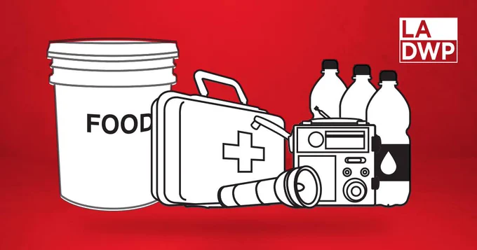 Emergency preparedness kit with a food bucket, first aid box, flashlight, radio, and water bottles on a red background.