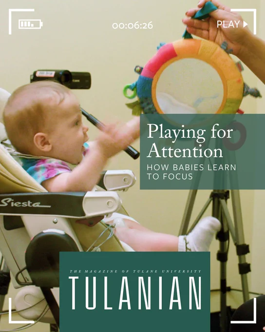 A baby in a high chair reaches for a colorful toy held by an unseen person. The scene is set in an environment resembling a child development study, with a camera recording nearby. Text on the image reads, "Playing for Attention: How Babies Learn to Focus," and "The Magazine of Tulane University" with "Tulanian" prominently displayed.