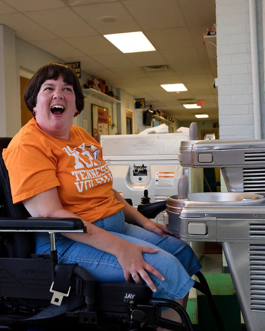 woman using a wheelchair accessible water fountain
