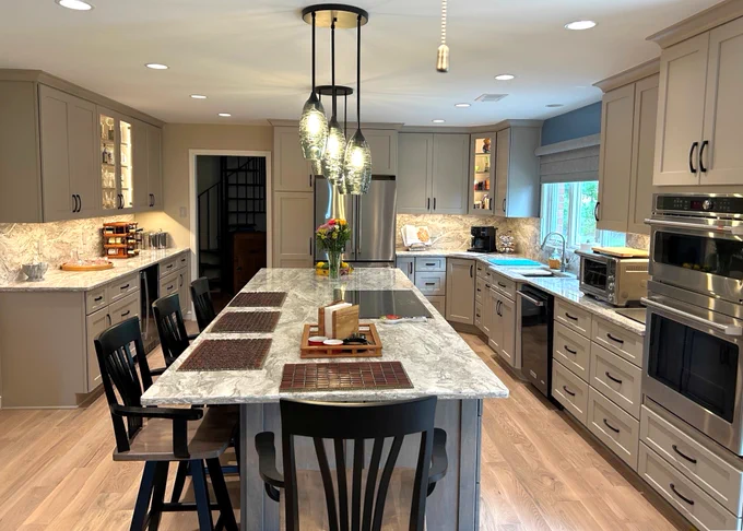 Q: What storage solutions were incorporated?
A: This kitchen is packed with smart storage with deep drawers, pull-out organizers, a custom pantry, and built-in features that keep everything accessible and clutter-free.
Q: Is this kitchen designed for everyday living or entertaining?
A: Both. The layout was intentionally designed to support daily functionality while also making it easy to host family and friends.
Q: What role does lighting play in the design?
A: Layered lighting including pendant lights, recessed lighting, and under-cabinet illumination adds warmth, visibility, and a polished finish.
Q: What’s the overall style of this remodel?
A: A clean, modern look with timeless elements that perfectly balancing style, comfort, and long-term value.
Q: What’s the biggest takeaway from this project?
A: A well-designed kitchen isn’t just about looks it’s about creating a space that works beautifully for how you live.
Thinking about transforming your kitchen? Let’s talk.
