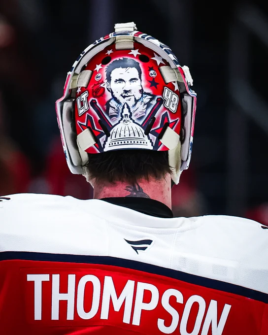 A photo of the backplate of Logan Thompson's Screaming Eagle mask, which prominently features Tom Wilson.