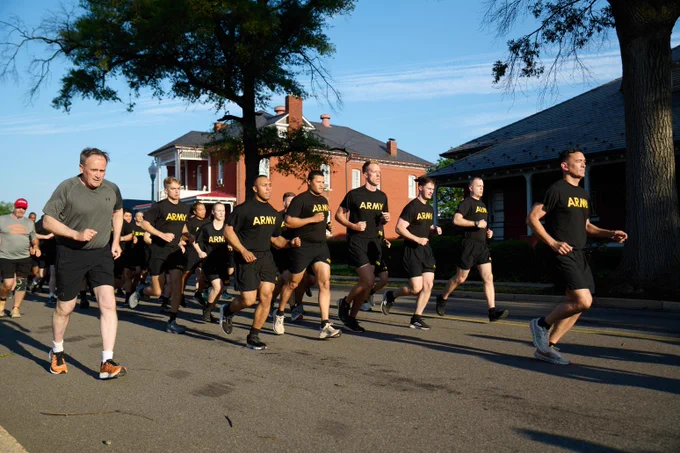 A group in shirts for the US Army run outdoors