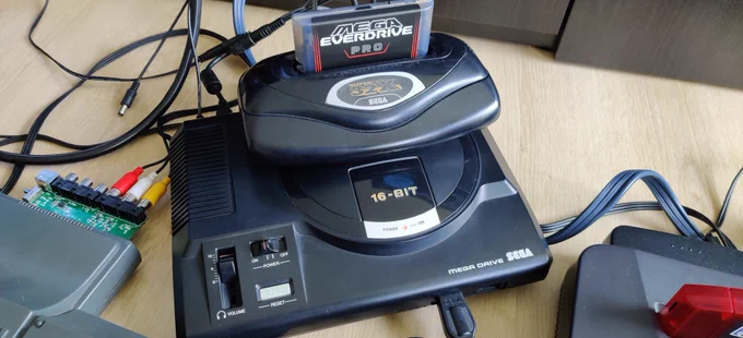 Japanese Sega 32X (Super 32X) stacked on a PAL Sega Mega Drive model 1, with a Mega Everdrive Pro flashcart in the 32X cartridge slot, set up to test the switchless auto-hertz region mod.