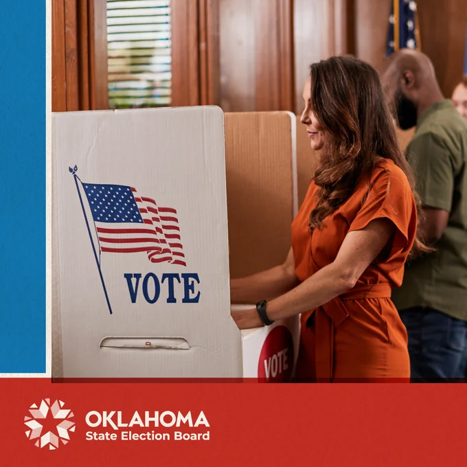 Photograph of a woman voting her ballot in her voting booth. A graphic of the Oklahoma State Election Board logo frames the bottom of the photograph.