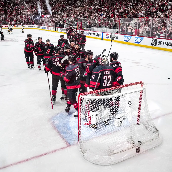 Photo of the Canes lining up to hug Brandon Bussi after a win
