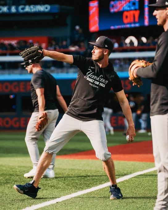 Cody Bellinger tosses pregame in Toronto.