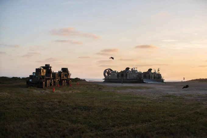 U.S. Navy landing craft, air cushion (LCAC) 10, attached to Assault Craft Unit 5, prepares to take on personnel and equipment assigned to 15th Marine Expeditionary Unit, I Marine Expeditionary Force, during an in-stream onload at Marine Corps Base Camp Pendleton, California, June 8, 2026. The in-stream onload transported personnel and equipment to Wasp-class amphibious assault ship USS Essex (LHD 2) as part of the 15th Marine Expeditionary Unit’s embarkation process for RIMPAC 2026. Thirty-one nations, 36 surface ships, 5 submarines, 15 national land forces, more than 206 aircraft and 25,000 personnel are participating in RIMPAC in and around the Hawaiian Islands, June 24 to July 31. The world’s largest international maritime exercise, RIMPAC provides a unique training opportunity while fostering and sustaining cooperative relationships among participants critical to ensuring the safety of sea lanes and security on the world’s oceans. (U.S. Marine Corps photo by Cpl. Kenneth Twaddell)