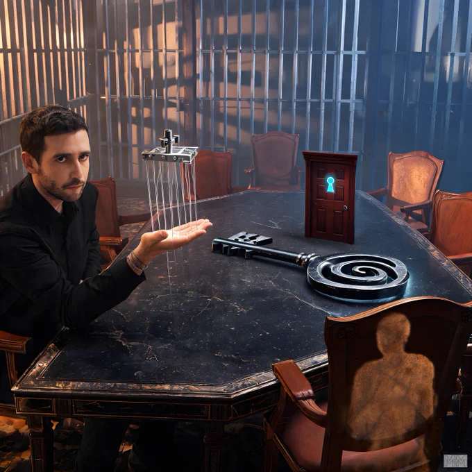 A man in a black shirt sits at a large, dark marble table. He holds a mechanical device with strings in his left hand. On the table, there is a large, metallic key with a spiral design and a small, red door with a blue keyhole symbol. Several empty chairs surround the table. A translucent silhouette of a person is visible in one of the chairs. The background shows vertical metal bars.