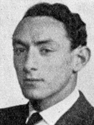 Black and white portrait of a man wearing a suit and tie.
