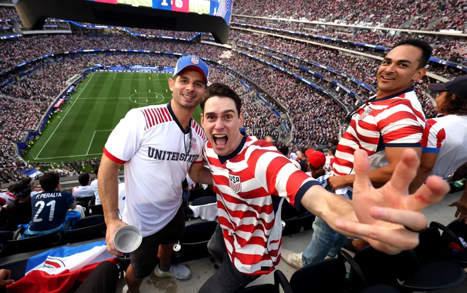 Fans of USA cheer inside Los Angeles Stadium.