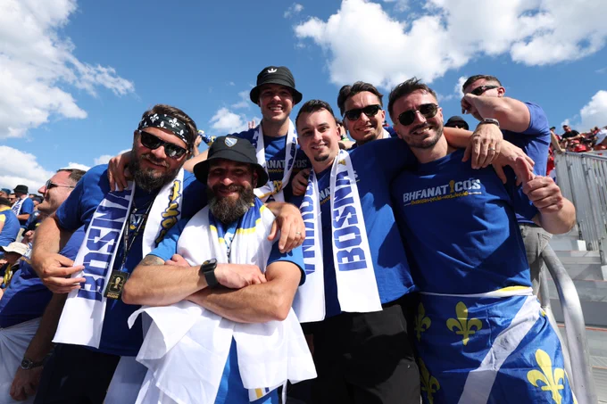 Fans of Bosnia & Herzegovina pose for a photo inside Toronto Stadium.
