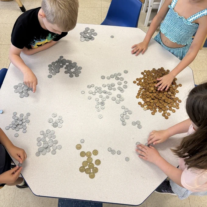 student sorting coin