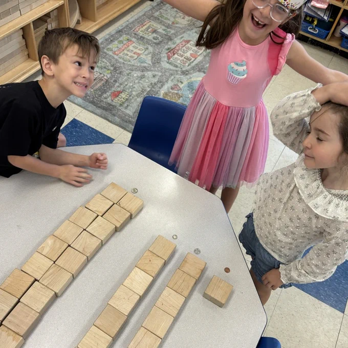 students using blocks to represent