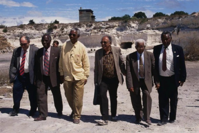 Nelson Mandela and his fellow defendants from the Rivonia Trial in 1994 revisit the lime quarry where they worked while imprisoned at Robben Island after the 1963-1964 trial in Pretoria [File: Louise Gubb/Corbis Saba via Getty Images]