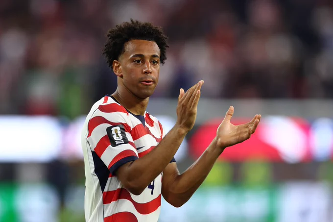 Tyler Adams applauds the fans after the USA beat Paraguay at the FIFA World Cup