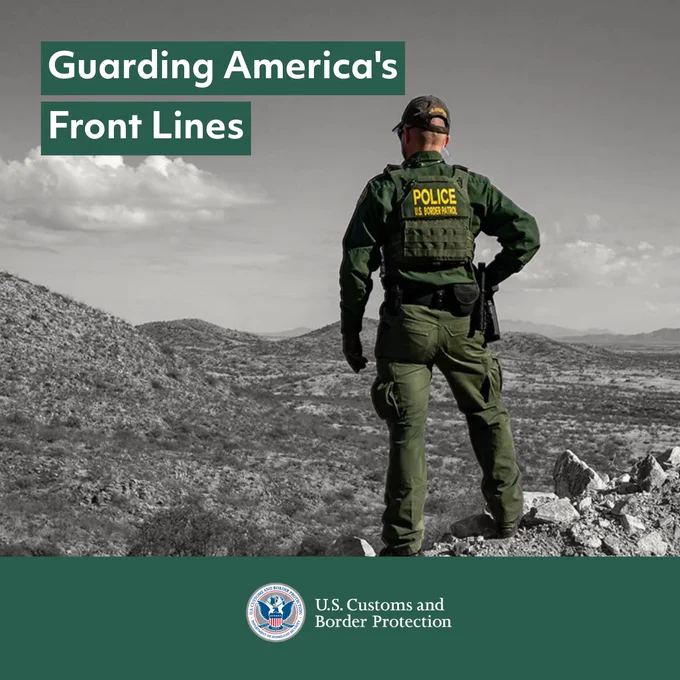 U.S. Customs and Border Protection agent stands overlooking a vast desert landscape. Guarding America's Front Lines.
