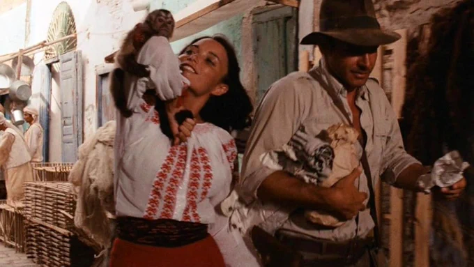 Marion Ravenwood (Karen Allen) and Indiana Jones (Harrison Ford) on the streets of Cairo.
