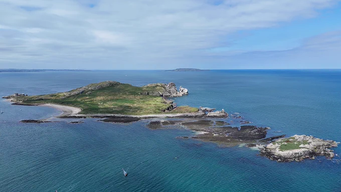 Aerial view of Ireland’s Eye off Howth, showing the island surrounded by the sea, where Tog Hackerspace and South Dublin Radio Club plan a Parks on the Air activation.”