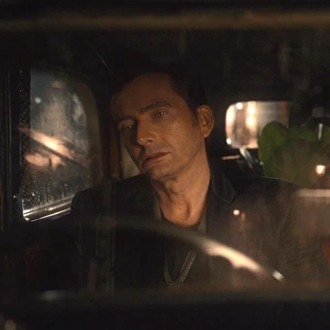 crowley sitting in bentley looking devastated
