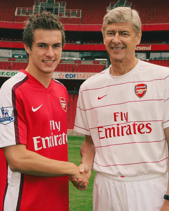 Arsene Wenger shakes hands with new signing Aaron Ramsey at Emirates Stadium (2008)