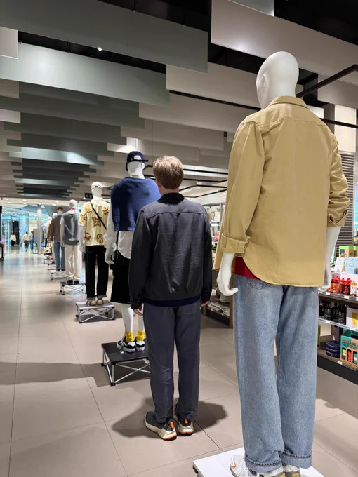 Me in a line of mannequins in a shop