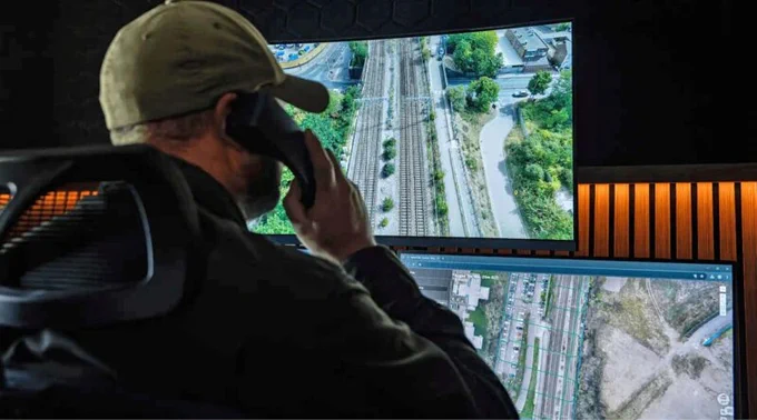 Remote drone operator monitors railway infrastructure from a control centre during a BVLOS DJI Dock operation for Network Rail.