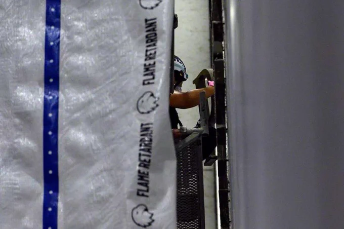 A worker removes the 'P' in Trump's name from the Kennedy center.
