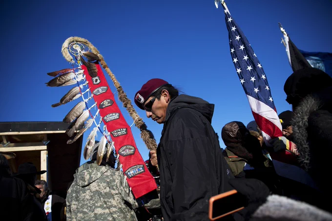 Native veterans join an interfaith ceremony at the Oceti Sakowin camp where people gathered to protest the Dakota Access oil pipeline in Cannon Ball, North Dakota, on Sunday, Dec. 4, 2016. An organizer with Veterans Stand for Standing Rock said the group is there to help out those who've dug in against the four-state, $3.8 billion project. 