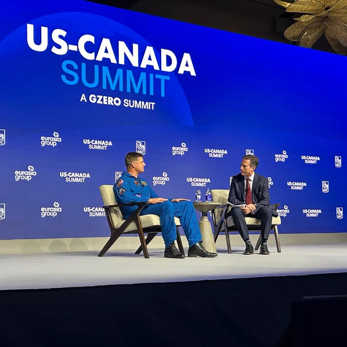 Astronaut Jeremy Hansen speaking on stage at the US-Canada Summit.
