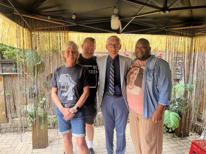 Gov. Evers poses for a group photo