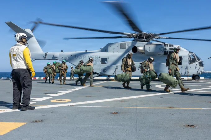 U.S. Marines with Marine Heavy Helicopter Squadron (HMH) 461 land aboard the San Antonio-class amphibious transport dock ship USS Arlington (LPD 24) during the Type Commander’s Amphibious Training off the coast of North Carolina, June 11, 2026. TCAT is a military exercise designed to enhance mobility and integration between the U.S. Marine Corps and the U.S. Navy. The amphibious force is an integrated powerhouse providing sea, land, and air operations, giving geographic combatant commanders a more flexible, agile force for aggregated or dis-aggregated operations across the globe. (U.S. Marine Corps photo by Staff Sgt. Stephen Campbell)