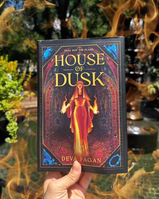 Hardcover book in front of nature with flames overlayed