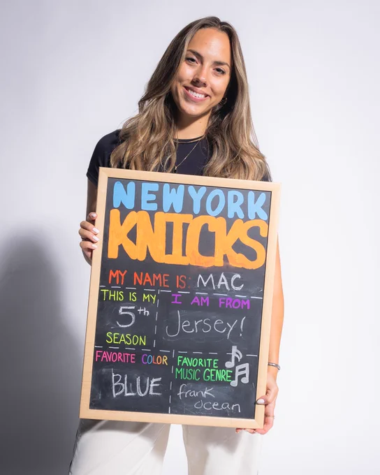 McKayla holding sign with information about her