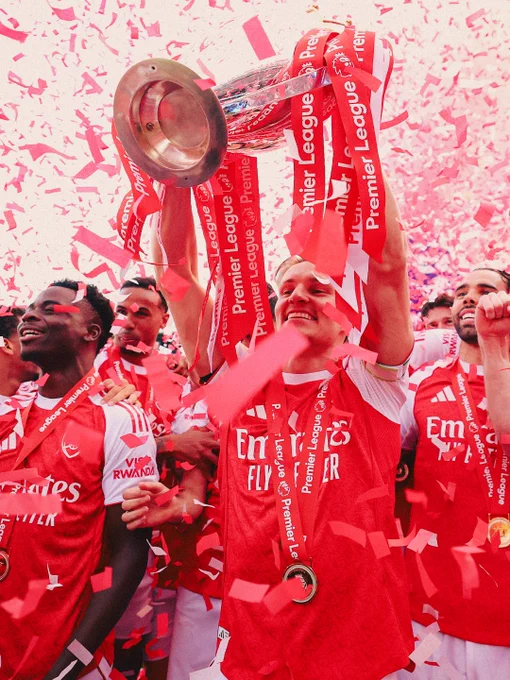 Martin Odegaard lifts the Premier League trophy