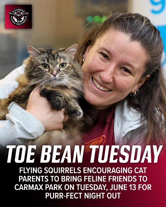 A woman smiles while holding a fluffy cat at the Richmond Flying Squirrels' event, encouraging cat owners to visit CarMax Park.