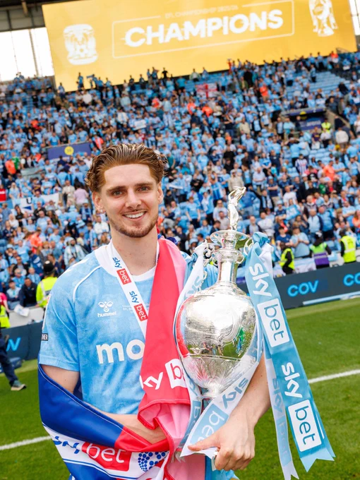 Jack Rudoni posing with the Championship trophy.