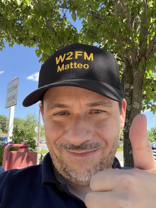 Matteo and his hat with his W2FM call sign on it.