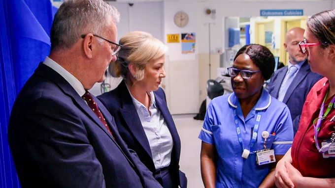 Health Minister Mike Nesbitt and First Minister Michelle O’Neill, with staff from the Mater Hospital.