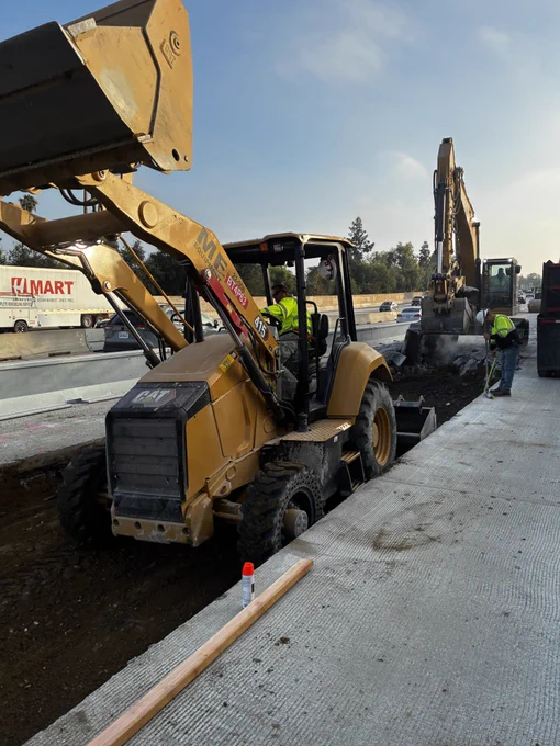 Excavator and front loader demolishing old concrete. 