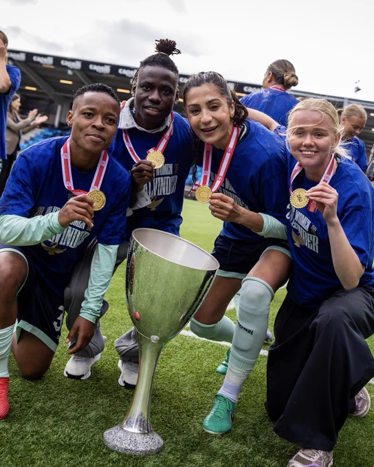 HB Koge Women posing with their medals and trophy from winning the league
